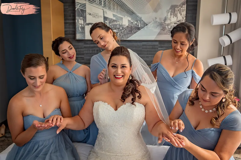 Doodle FLy Photography wedding photo of Bride and bridesmaids getting ready  at Burroughs Home Venue in Fort Myers Florida