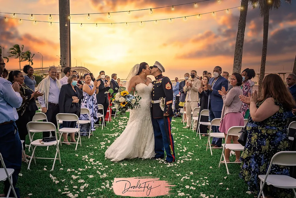 Doodle FLy Photography wedding photo of bride and groom kissing at Burroughs Home Venue in Fort Myers Florida